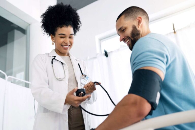Nursing student practicing blood pressure assessment during clinical skills training